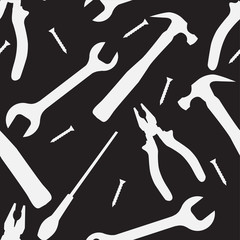 Seamless black and white texture with silhouettes of working tools. Vector pattern for your creativity