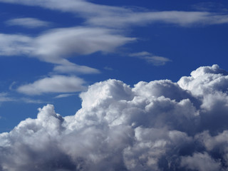 Naklejka na ściany i meble Sky blue with white dramatic clouds below background