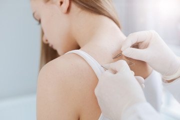 Involved girl getting consultation of the specialist in the hospital
