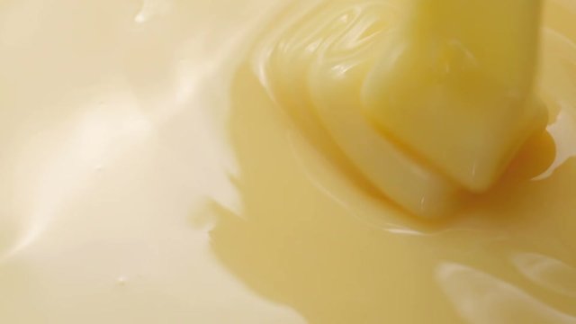 Pouring sweetened condensed milk. Close-up shot.

