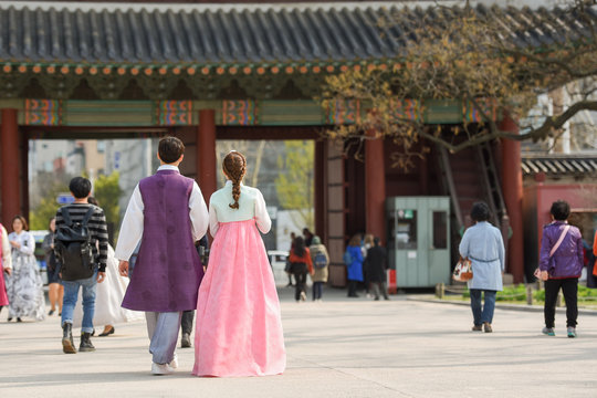 Couple in traditional Korean walk in the vintage temple