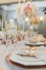 Napkin put in a golden ring lies on fancy dinner plate