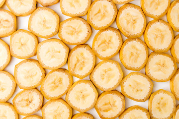 Background of sliced banana slices on white table