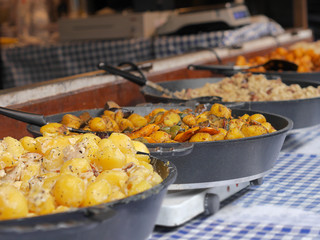 Cooking and frying potatoes and vegetable dishes. Farmers' markets with snacks.