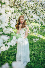  A girl in a blooming garden