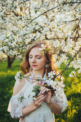  A girl in a blooming garden