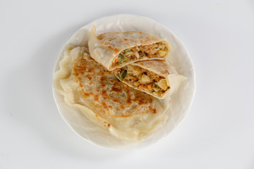 cabbage dumpling on a plate isolated on white background
