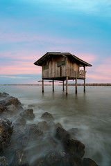 Old house at seashore in Samutsakorn province, center of Thailand.