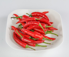 chili on a plate isolted on white background
