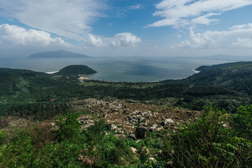 White clouds hang over the green shore in Vietnam