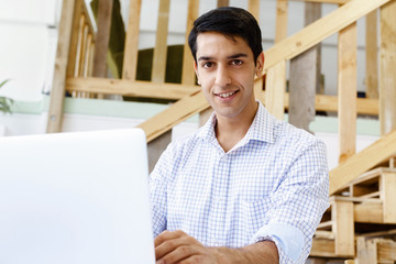 Portrait of young man in office