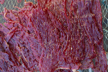 Close up texture of seasoning sun dried beef using local procedure of food preservation in Thailand.