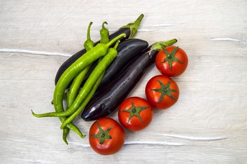 Natural tomatoes, green peppers and aubergines, vegetable paintings in different concepts, intestinal tomatoes and peppers, fresh tomatoes and green peppers,
