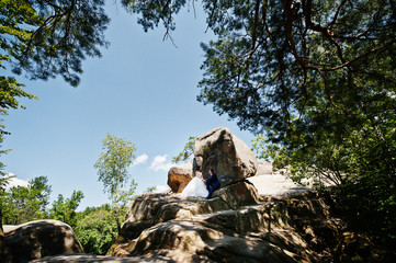 Lovely wedding couple at amazing landscapes with rock Dovbush, Carpathian mountains at Ukraine.