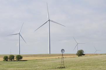 Old and New Wind Turbine on a Wind Farm