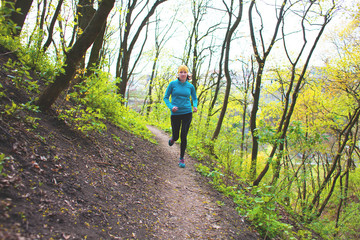 Obraz premium Girl running in the woods..