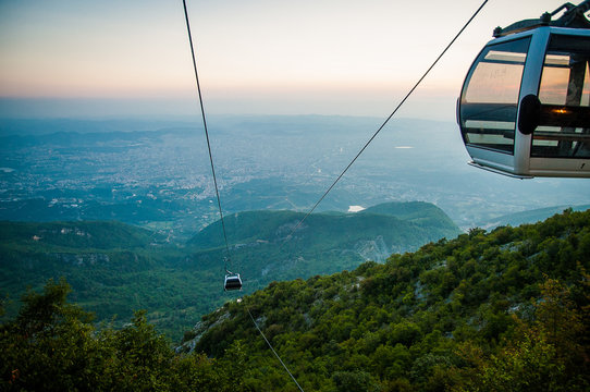 2016 Albania Tirana view from Dali moutain to the city. Line trolleyin an evening sun