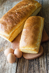 bread baked in the oven and eggs on the table