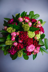 Look from above at bouquet of green and pink flowers