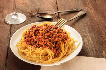 Plate of pasta with meat and tomato sauce