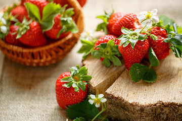 red strawberries on wood table.