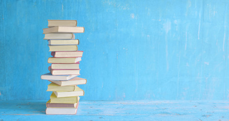 books on blue grungy background, free copy space