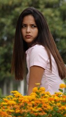 Serious Teen Girl With Flowers