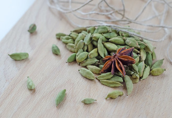 Dry aroma cardamon on the wooden board