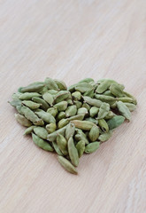 Dry aroma cardamon on the wooden board