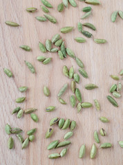Dry aroma cardamon on the wooden board