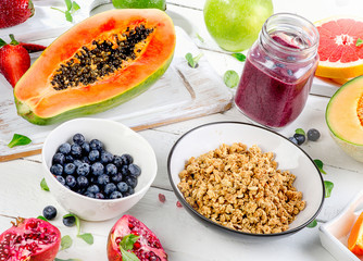 Breakfast with smoothies,  muesli and berries.