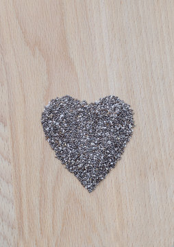 Chia seeds on wooden cutting board