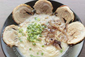 close up of chashu pork ramen on wooden table
