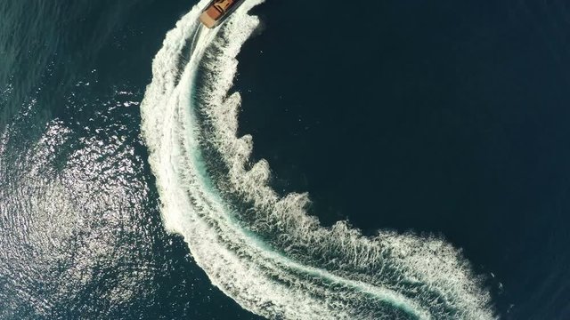 Aerial view of a maxi rib navigating fast.