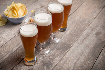 glass beer on wood background
