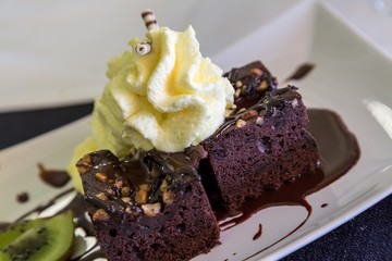 Delicious chocolate cakes, brownie on table close-up