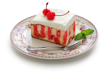 homemade cherry poke cake isolated on white background