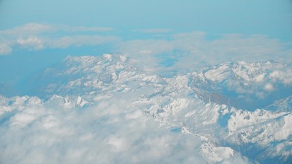 Fototapeta premium The Alps mountains and clouds, aeial view