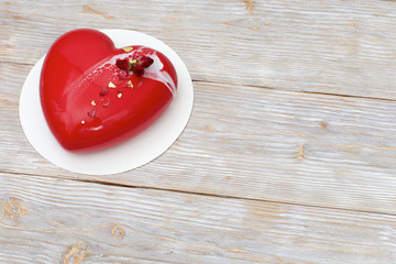 Red mousse cake in the shape of heart