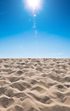 Sand dunes on blue sky background