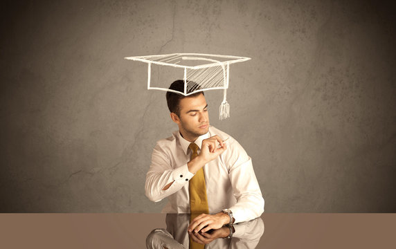 Happy college graduate drawing academic hat