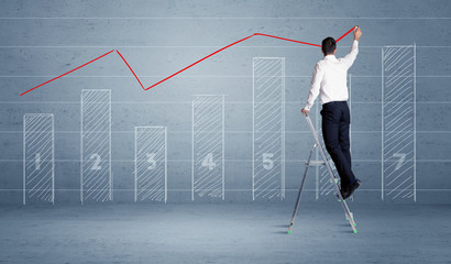 Man drawing chart from ladder