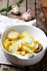 Baked new  potato with herbs .style rustic