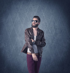 Bearded hipster standing in elegant clothes