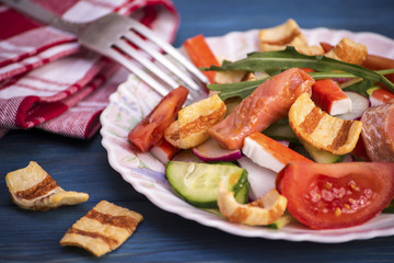 Salad with vegetables and red fish