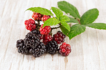 blackberries and raspberries on a table