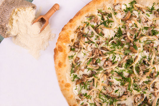 Pizza mushroom with champignons, oyster mushrooms and cepes with cheese sauce
