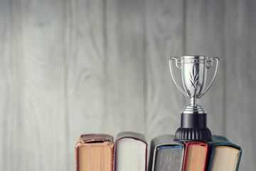 Naklejka premium Books and sports cup
