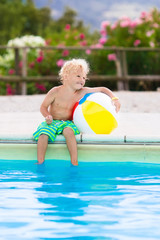 Child in swimming pool on summer vacation