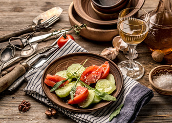 Simple salad of cucumers and tomatoes, rustic dishes